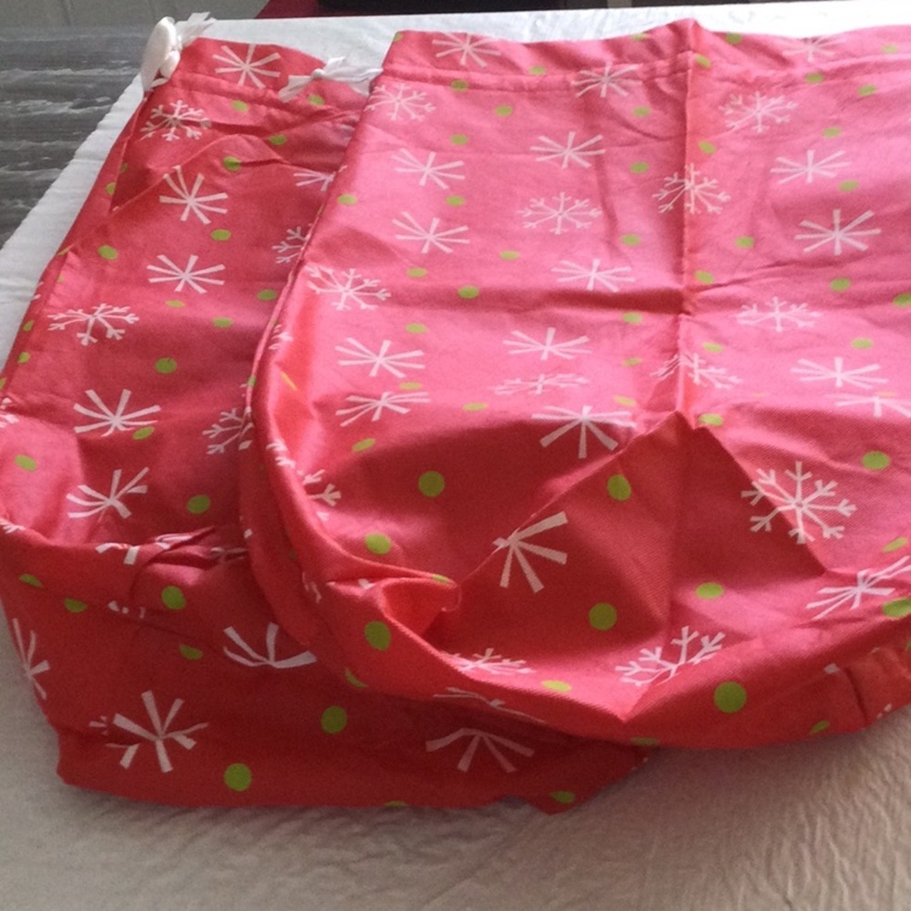 Two Festive Red and Green Vinyl bags with ties strings on top. NWOT